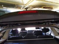 Kia Carens Guarnecido Bajo alerón 1.jpg